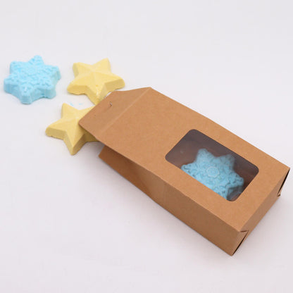Follow the Star Christmas Bath Bomb Gift Pack featuring a charming brown box with a clear window, revealing snowy blue and yellow star-shaped bath bombs, ideal for enhancing your Christmas gift home fragrance.