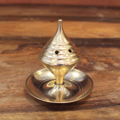 Small Brass Incense Burner - Elegant Design for Meditation resting on a wooden surface, showcasing its polished brass finish. Ideal for creating a calming atmosphere, this incense burner is the perfect Christmas gift for home fragrance enthusiasts.