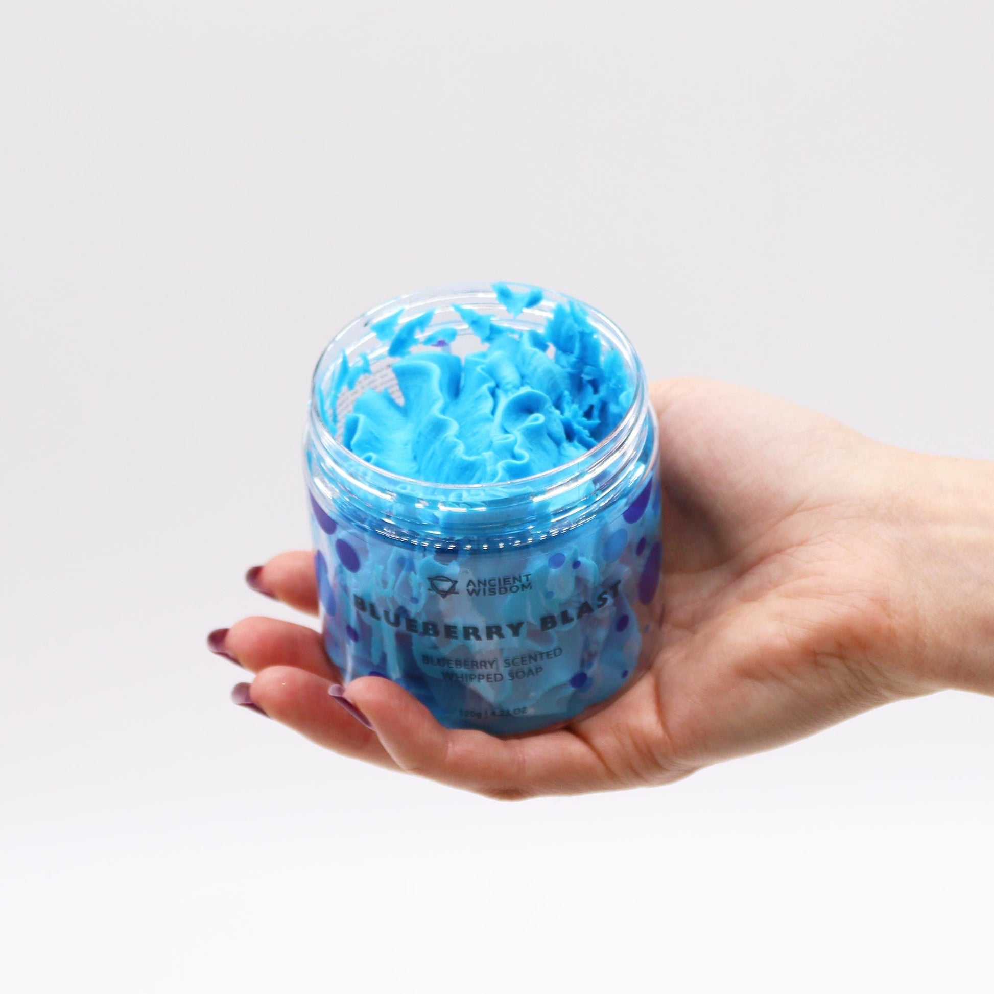 Blueberry Whipped Soap 120G jar held in a hand, showing the rich whipped texture, making it a luxurious vegan skincare option and an excellent Christmas gift for home fragrance.