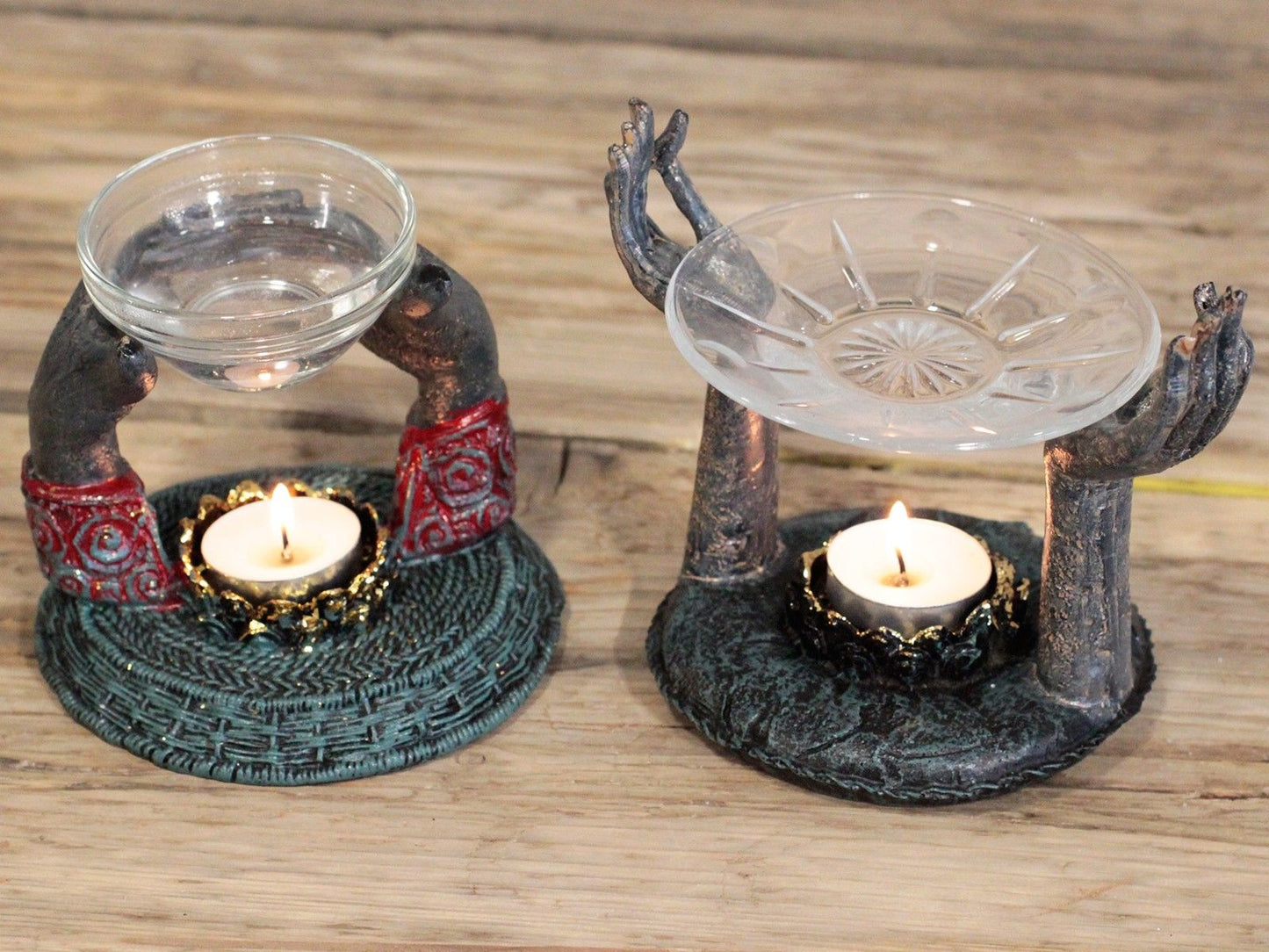 An elegant display of two Antique Buddha Oil Burners, featuring decorative hands and essential oil bowls, perfect for stress relief. A thoughtful Christmas gift for those who appreciate home fragrance.