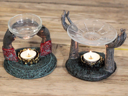 An elegant display of two Antique Buddha Oil Burners, featuring decorative hands and essential oil bowls, perfect for stress relief. A thoughtful Christmas gift for those who appreciate home fragrance.