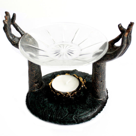 Antique Buddha Om Hands Oil Burner â€“ Zen Home Decor featuring an elegant design with raised hands holding a glass oil dish and a candle holder, perfect for creating a relaxing atmosphere. This burner serves as a scent enhancer and makes a thoughtful Christmas Gift Home Fragrance.