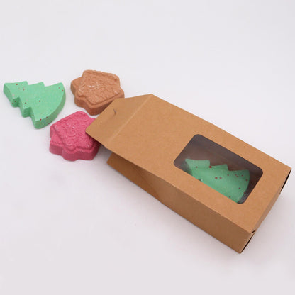 Gingerbread Town Christmas Bath Bomb Gift Pack showing pink gingerbread and green Christmas tree bath bombs in a kraft box, perfect for festive enjoyment. Warm Gingerbread scent, a joyful Christmas gift home fragrance.