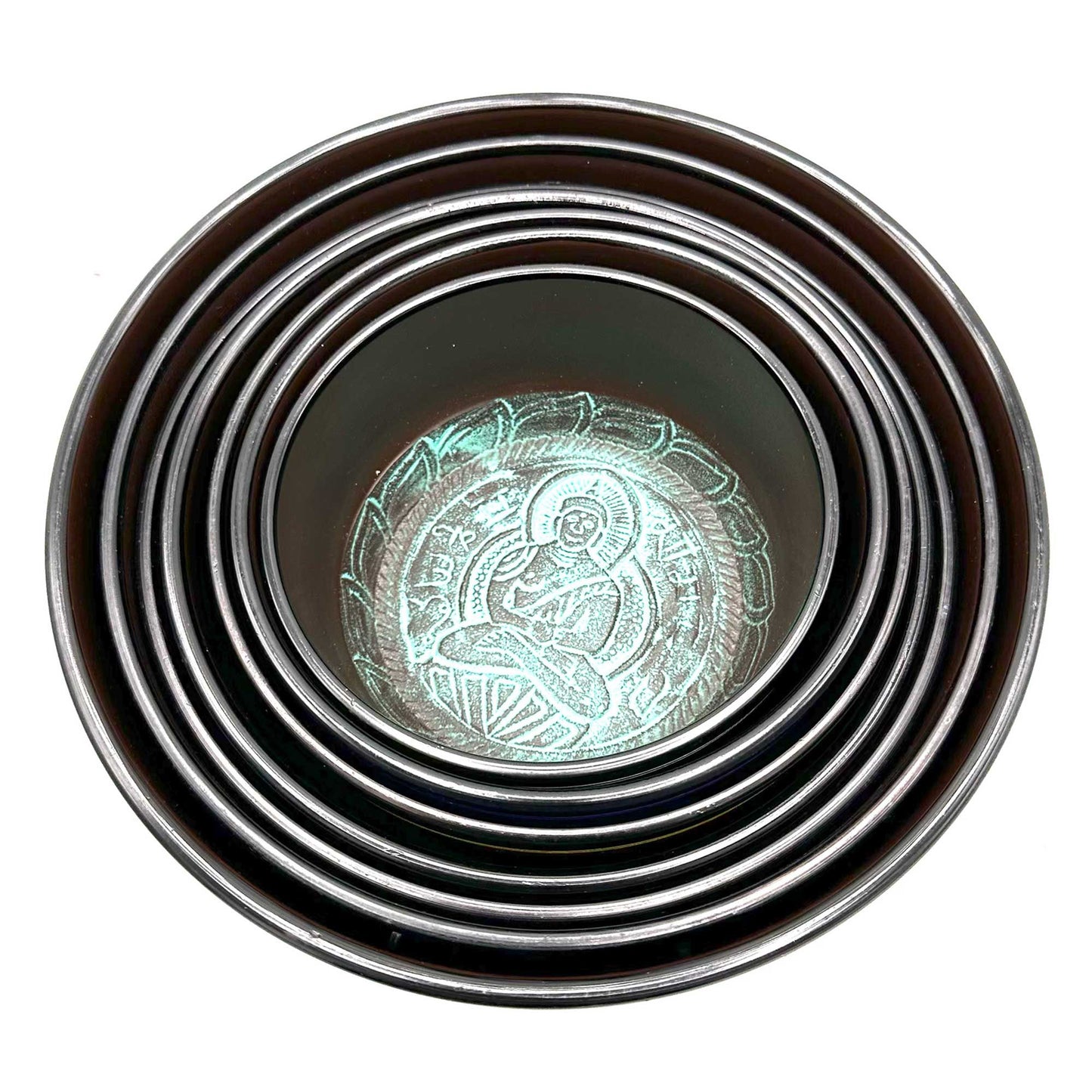 Top view of stacked singing bowls from the Large 7 Chakra Singing Bowls Set, featuring intricate designs perfect for enhancing your home décor. A thoughtful Christmas gift for wellness and fragrance.