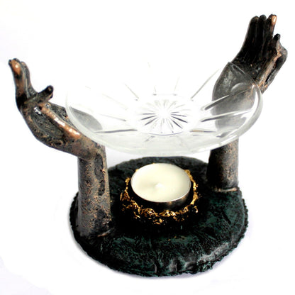 Antique Buddha Om Hands Oil Burner – Zen Home Decor showcasing intricate hands that cradle a glass dish for oils and a candle holder, ideal for inviting serenity into any space. A great choice for a Christmas Gift Home Fragrance.