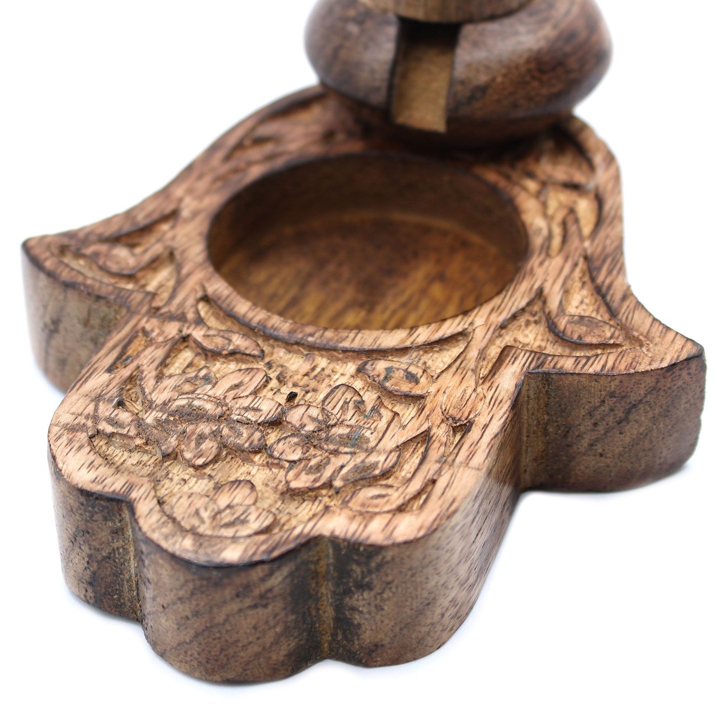 Close-up view of the Sm Mango Wood Backflow Burner - Hamsa, highlighting detailed woodwork and craftsmanship, perfect for enhancing your home decor. A beautiful choice for a Christmas gift, bringing a soothing scent to any space.