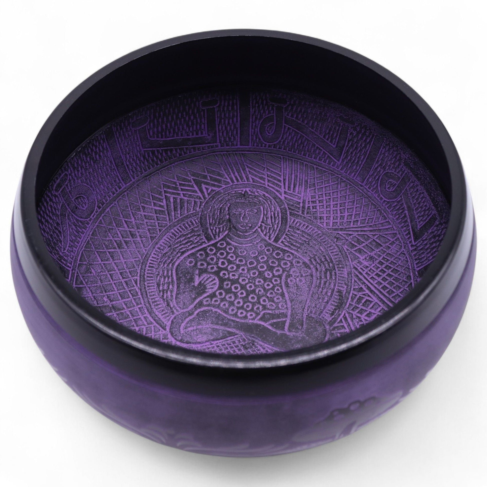 Inside view of the Extra Loud Purple Haze Singing Bowl, displaying a serene meditating figure, perfect for promoting deep relaxation. This unique {{scent}} {{product_type}} – Christmas Gift Home Fragrance enhances any meditation space.