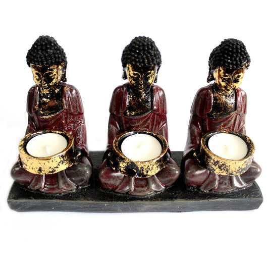 Antique Buddha Candle Holder with 3 Devotees - Zen Home Decor, featuring three Buddha figures with golden candle holders, perfect for creating a serene atmosphere. Ideal for adding a peaceful touch to your living space. This {{scent}} {{product_type}} â€“ Christmas Gift Home Fragrance enhances relaxation and mindfulness.