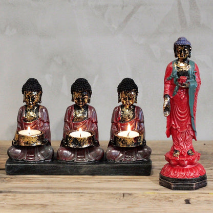 Antique Buddha Candle Holder with 3 Devotees - Zen Home Decor, featuring three Buddha figures with candles aglow and an additional Buddha statue, perfect for enhancing your spiritual decor. Create a calming ambiance in any room with this stunning piece. This {{scent}} {{product_type}} – Christmas Gift Home Fragrance makes a thoughtful gift for any occasion.