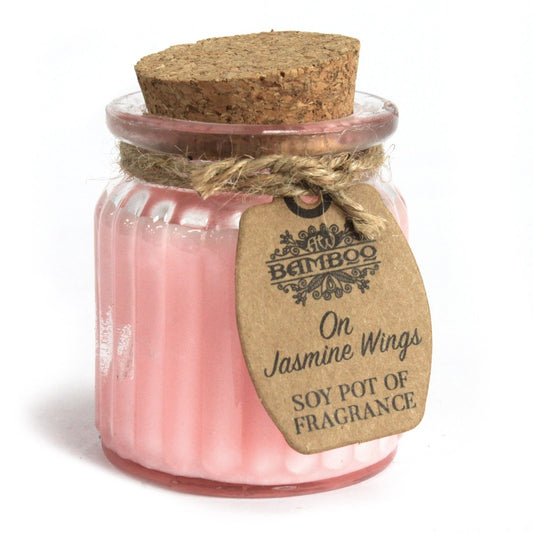 On Jasmine Wings Soy Wax Candle in a reusable glass jar featuring a cork lid, perfect for creating a warm atmosphere. Ideal as a Christmas gift, this soothing home fragrance enhances any space.