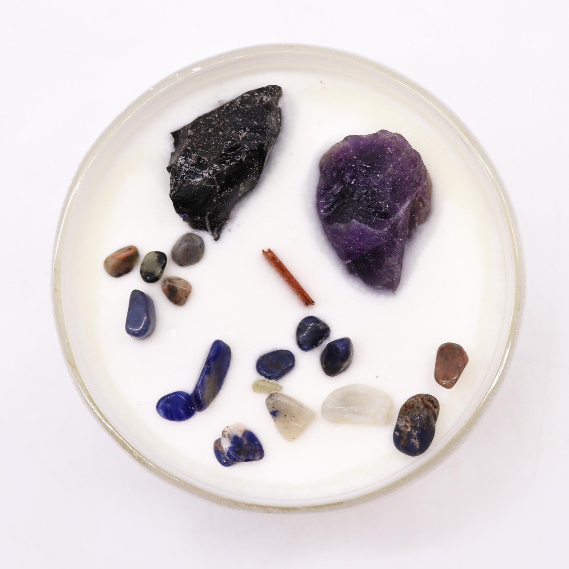 Top view of the Solar Plexus Chakra Candle featuring a variety of gemstones, including Amethyst and Black Agate, emanating the scent of "Deep in the Forest". Ideal for personal empowerment and as a thoughtful Christmas gift for home fragrance.