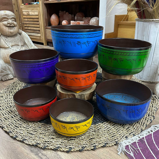Large 7 Chakra Singing Bowls Set showcasing vibrant bowls in various colours, perfect for creating a serene atmosphere in your home. Ideal as a Christmas gift and home fragrance addition.