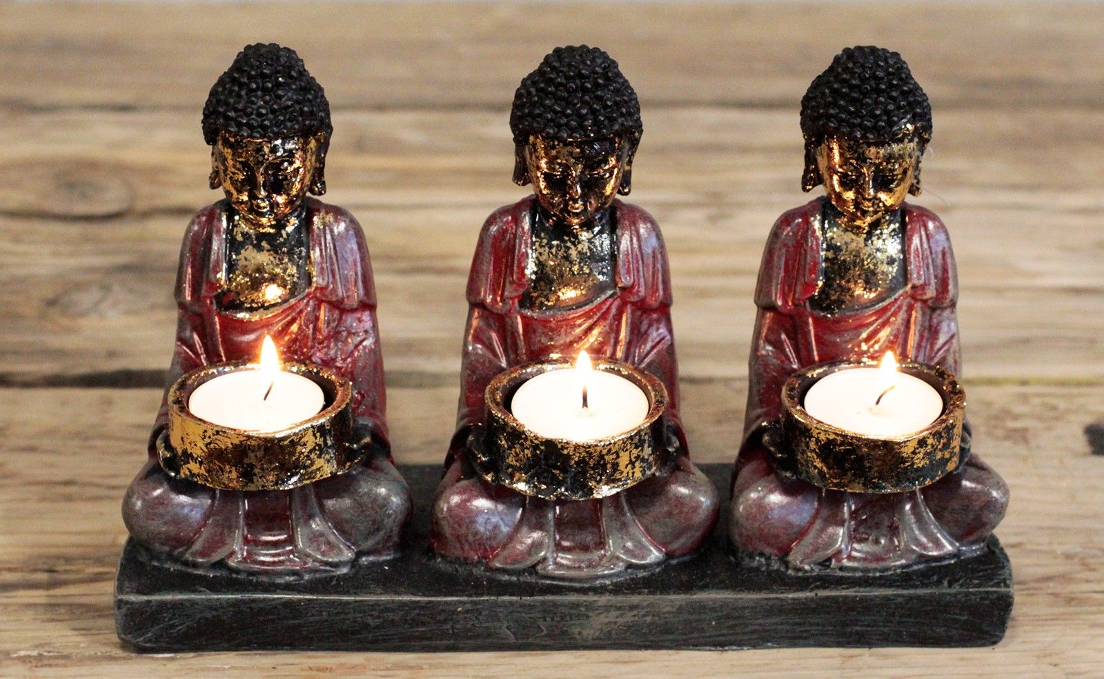 Antique Buddha Candle Holder with 3 Devotees - Zen Home Decor, showcasing three Buddhas with lit candles, bringing warm light and serenity to your home. Capture the essence of tranquillity in your meditation area. This {{scent}} {{product_type}} – Christmas Gift Home Fragrance is perfect for lovers of spiritual decor.