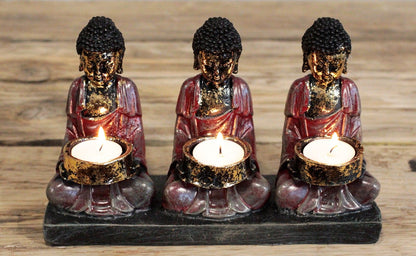 Antique Buddha Candle Holder with 3 Devotees - Zen Home Decor, showcasing three Buddhas with lit candles, bringing warm light and serenity to your home. Capture the essence of tranquillity in your meditation area. This {{scent}} {{product_type}} – Christmas Gift Home Fragrance is perfect for lovers of spiritual decor.