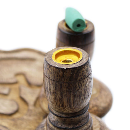 Overhead shot of the Sm Mango Wood Backflow Burner - Ohm, showing two incense cones in place, one green and one black, for an aromatic experience. A unique gift for fragrance lovers. {{scent}} {{product_type}} – Christmas Gift Home Fragrance.