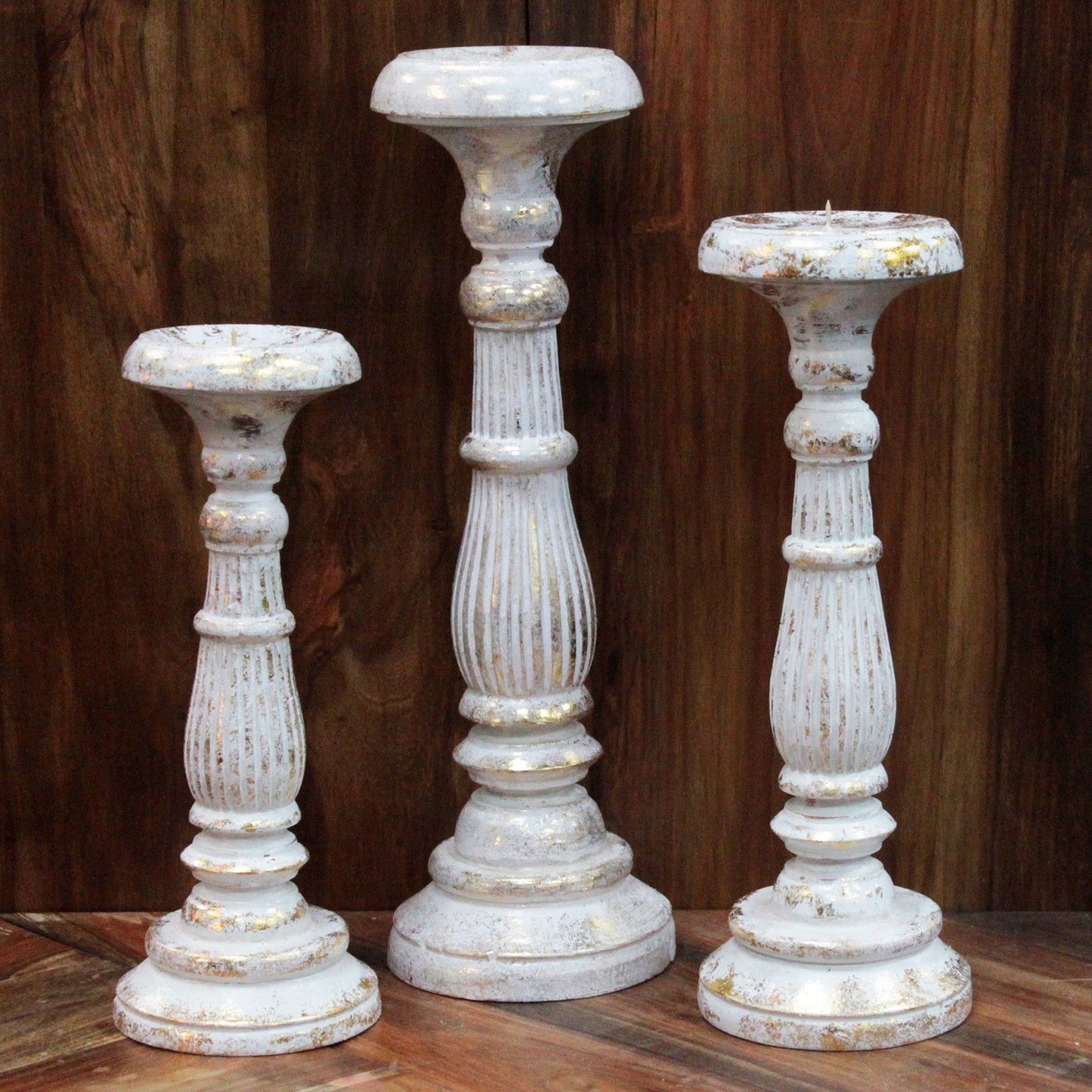 Artistic arrangement of Medium White Gold Candle Stands – Handcrafted Eco-Friendly Decor on a rustic wooden surface, highlighting the unique craftsmanship. Great for showcasing your favourite {{scent}} candles – Christmas Gift Home Fragrance.