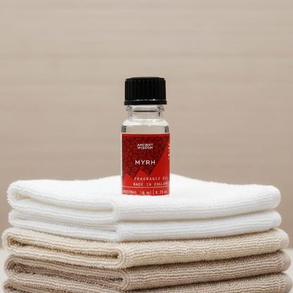 Xmas Myrrh fragrance oil in a decorative bottle, representing a long lasting fragrance oil that enhances home décor and personal care.