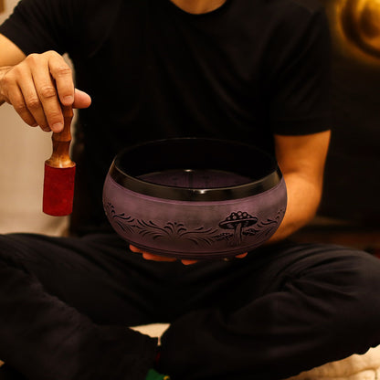A person preparing to play the Extra Loud Purple Haze Singing Bowl, capturing the essence of sound therapy in meditation. This captivating {{scent}} {{product_type}} – Christmas Gift Home Fragrance transforms the practice into a profound experience.