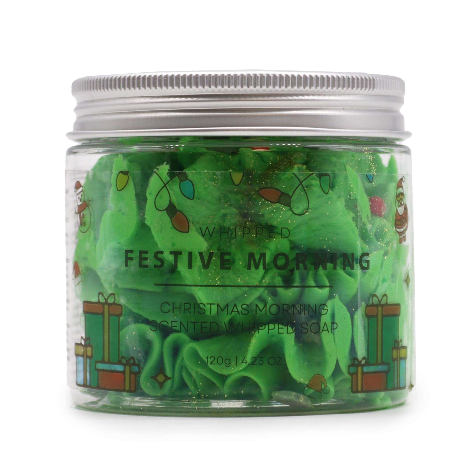 Festive Morning Whipped Soap 120g – Christmas Gift for Cosy Homes features a jar of vibrant green fluffy whipped soap adorned with charming holiday designs. This delightful product, with its soothing scent, serves as a perfect {{scent}} {{product_type}} – Christmas Gift Home Fragrance that brings festive cheer to your bathing experience.
