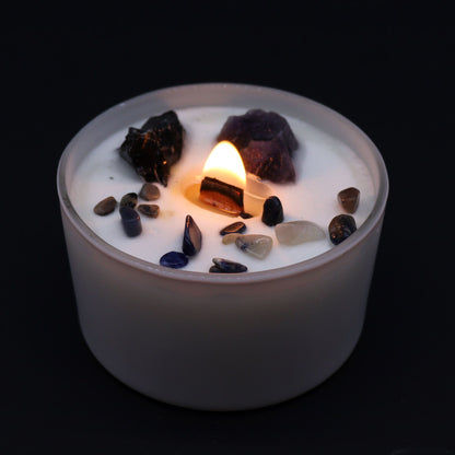 The Solar Plexus Chakra Candle lit, showcasing its glowing gemstones, particularly Amethyst and Black Agate. This candle diffuses the enchanting fragrance of "Deep in the Forest" and is an excellent choice for a Christmas gift to enhance home ambience.