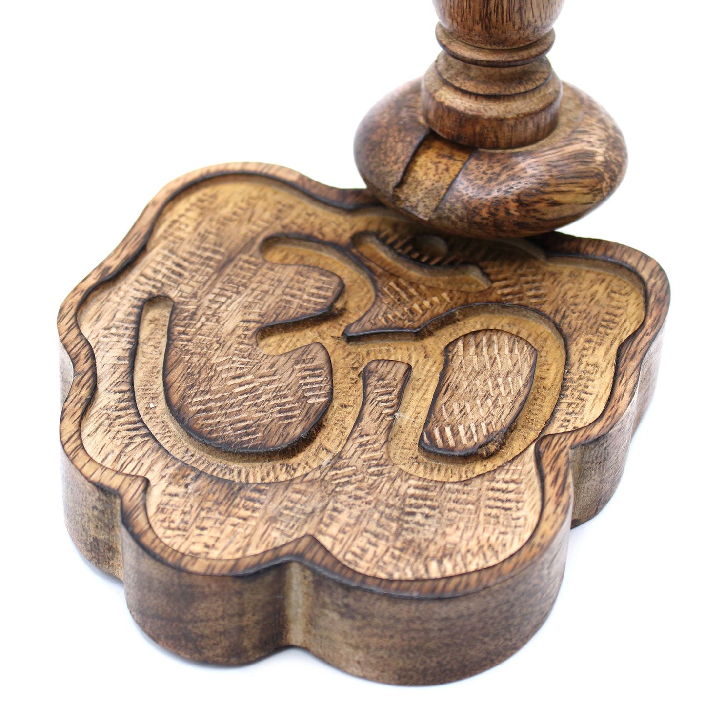 Close-up of the Sm Mango Wood Backflow Burner - Ohm, showcasing the intricate carved detail of the OM symbol on the base. Ideal for adding a touch of elegance to your space. {{scent}} {{product_type}} – Christmas Gift Home Fragrance.