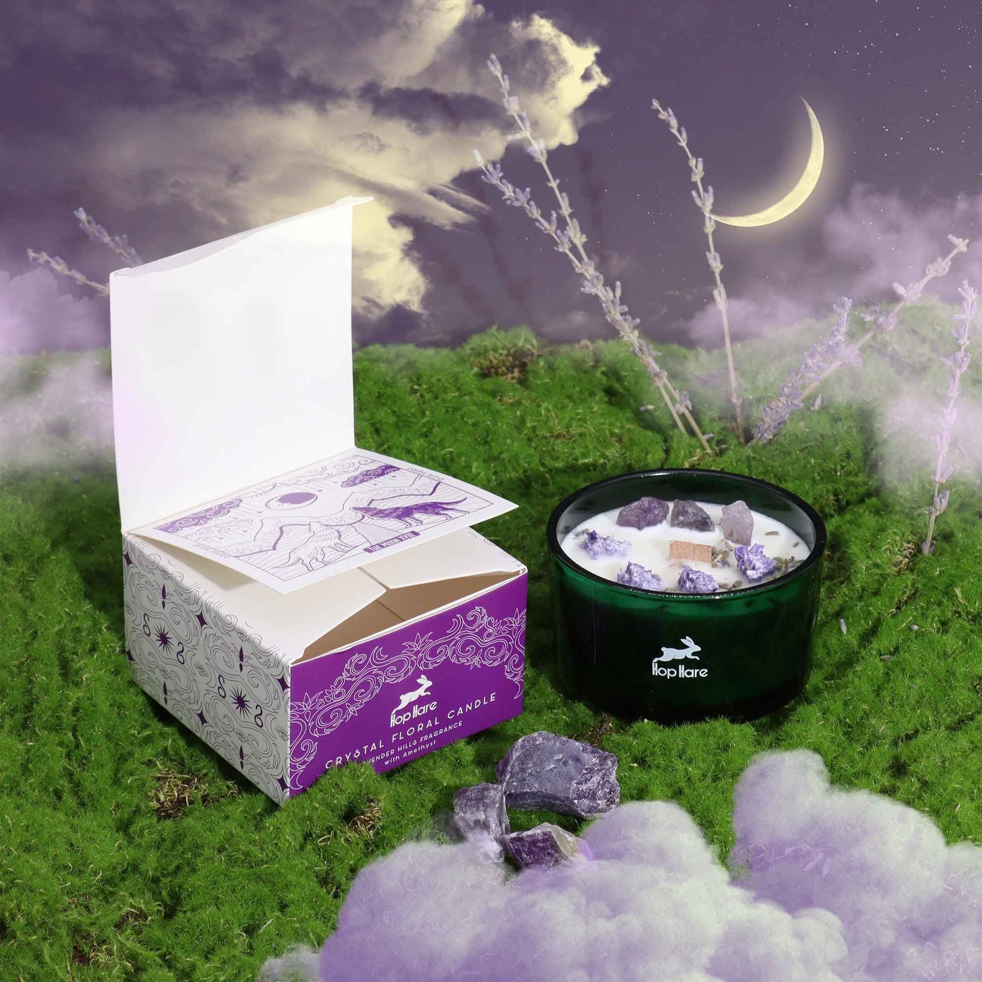 Amethyst Lavender Magic Flower Candle beautifully presented with its box, surrounded by ethereal mist and a crescent moon, perfect for creating a calming atmosphere. This scented candle serves as a stunning Christmas Gift Home Fragrance.