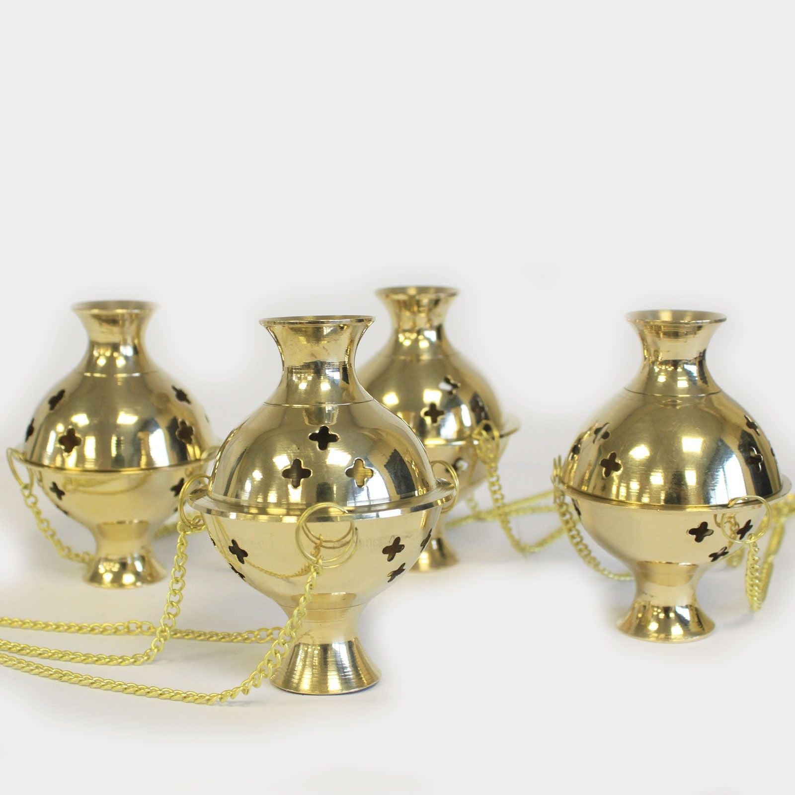 Hanging Brass Incense Burners - Ideal for Meditation & Rituals grouped together, emphasizing their shiny brass finish and intricate designs. These charming incense burners are perfect accents for any home and make for a delightful Christmas gift for enhancing home fragrance.