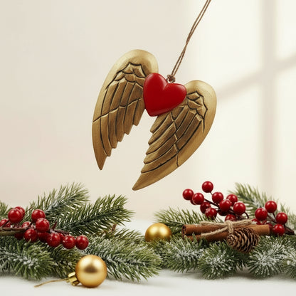 Decorative item with brown angel wings and a red heart on a white background