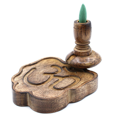 The Sm Mango Wood Backflow Burner - Ohm with a green incense cone placed on top, creating a beautiful aesthetic for home decoration. Perfect for gifting during the festive season. {{scent}} {{product_type}} – Christmas Gift Home Fragrance.