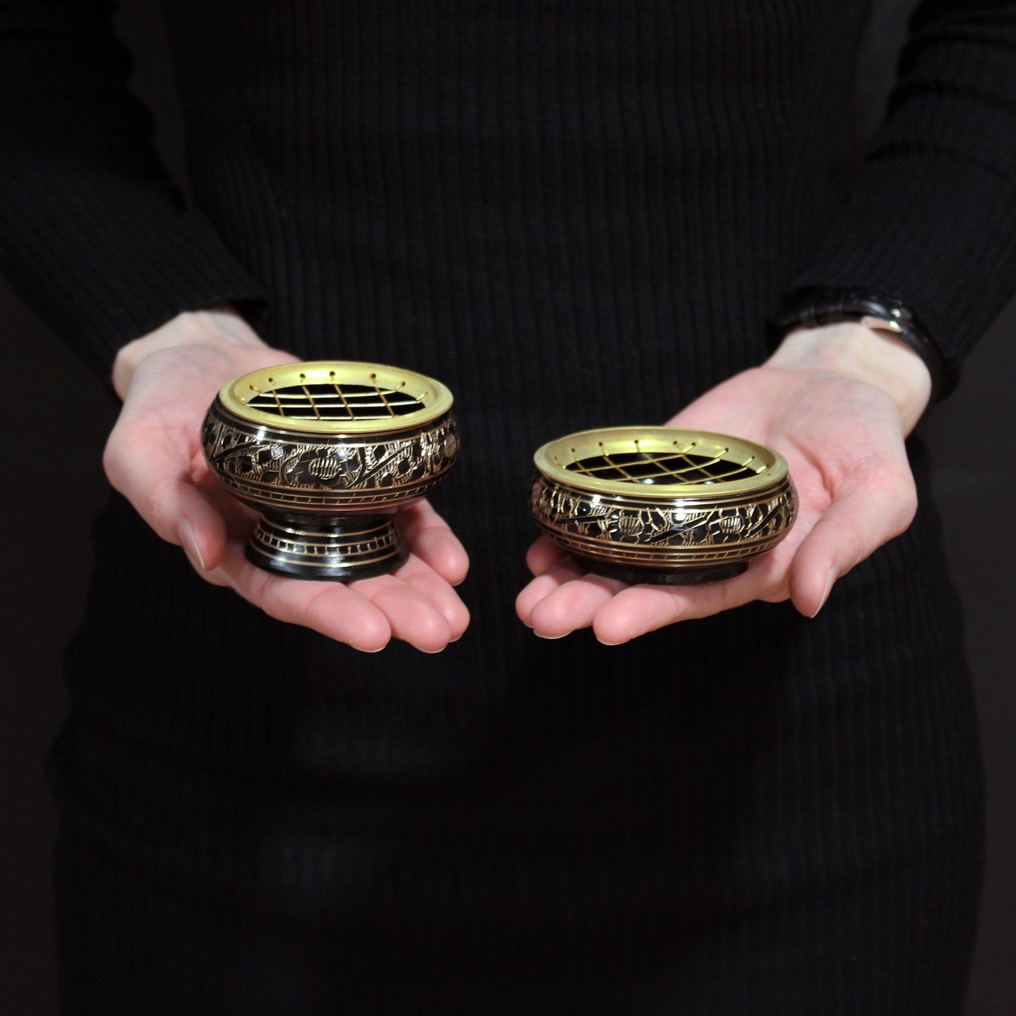 Elegant Brass Charcoal Burners held in hands, featuring intricate designs and removable mesh tops, perfect for easy incense burning. A thoughtful Christmas gift for anyone seeking to uplift their home fragrance.