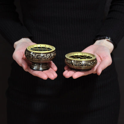 Elegant Brass Charcoal Burners held in hands, featuring intricate designs and removable mesh tops, perfect for easy incense burning. A thoughtful Christmas gift for anyone seeking to uplift their home fragrance.