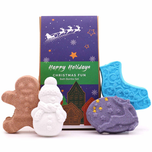 A festive display of the Christmas Fun Bath Bomb Gift Pack featuring a gingerbread man, snowman, ice skate, and reindeer bath bombs. This delightful collection brings joy and relaxation with the scents of Warm Gingerbread, Frosted Sugar Plum, Holly & Ivy, and Hot Chocolate. Perfect as a Christmas gift for home fragrance lovers.