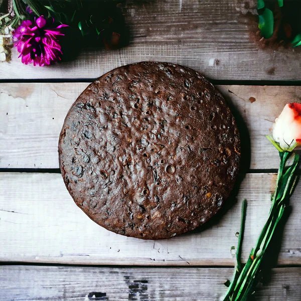 Gluten-free vegan Christmas fruit cake un-iced - ready to decorate yourself with brandy-soaked fruits