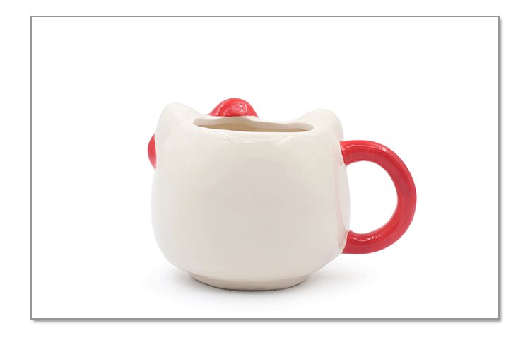 Close-up of the Hello Kitty ceramic mug adorned with the iconic Hello Kitty face and red bow, ideal as a hello kitty mug gift for any occasion.