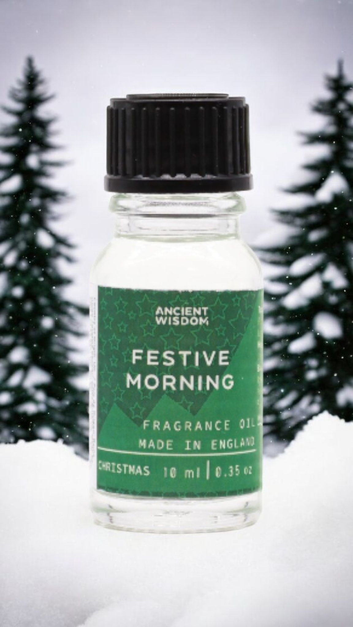 Festive Morning Fragrance Oil 10ml nestled in a winter wonderland, a great choice for Christmas gifts or stocking fillers. This delightful festive fragrance infuses your home with cozy winter spice scents, ideal for aromatherapy and pamper packs. Experience the inviting aromas of cinnamon orange and frankincense myrrh for a white Christmas feel.