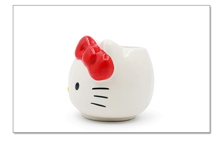 The adorable Hello Kitty mug gift set including the white ceramic mug and red gift box with polka dots, perfect for gifting to Hello Kitty fans.