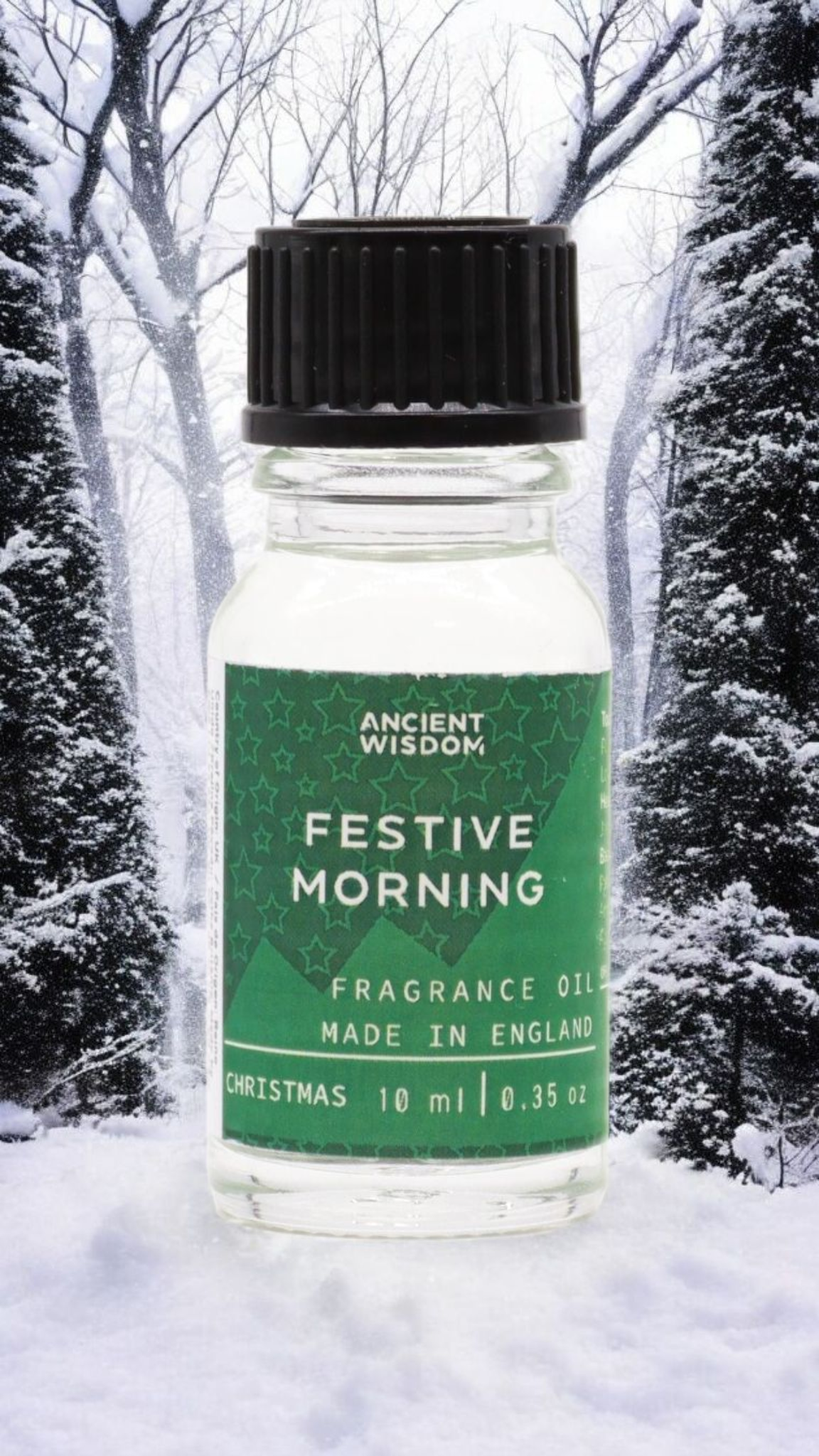 Festive Morning Fragrance Oil 10ml surrounded by frosty trees, a great choice for Christmas gifts or stocking fillers. This delightful festive fragrance enhances your home with notes of winter spice, making it an essential part of any pamper pack or aromatherapy experience. Embrace the scents of cinnamon orange and frankincense myrrh for a true winter wonderland vibe.