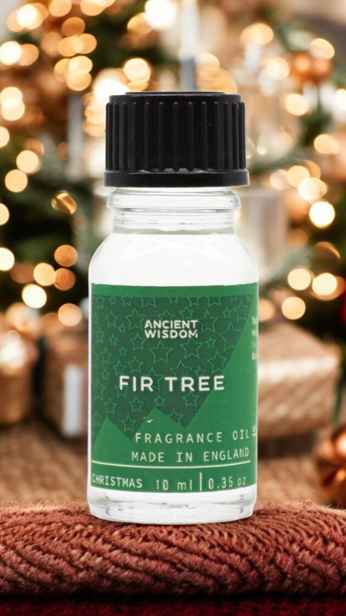 Fir Tree Fragrance Oil 10ml surrounded by Christmas decorations, an excellent option for winter ambiance. Perfect as a pamper pack addition or a thoughtful stocking filler, this festive fragrance supports a relaxing winter scent experience.