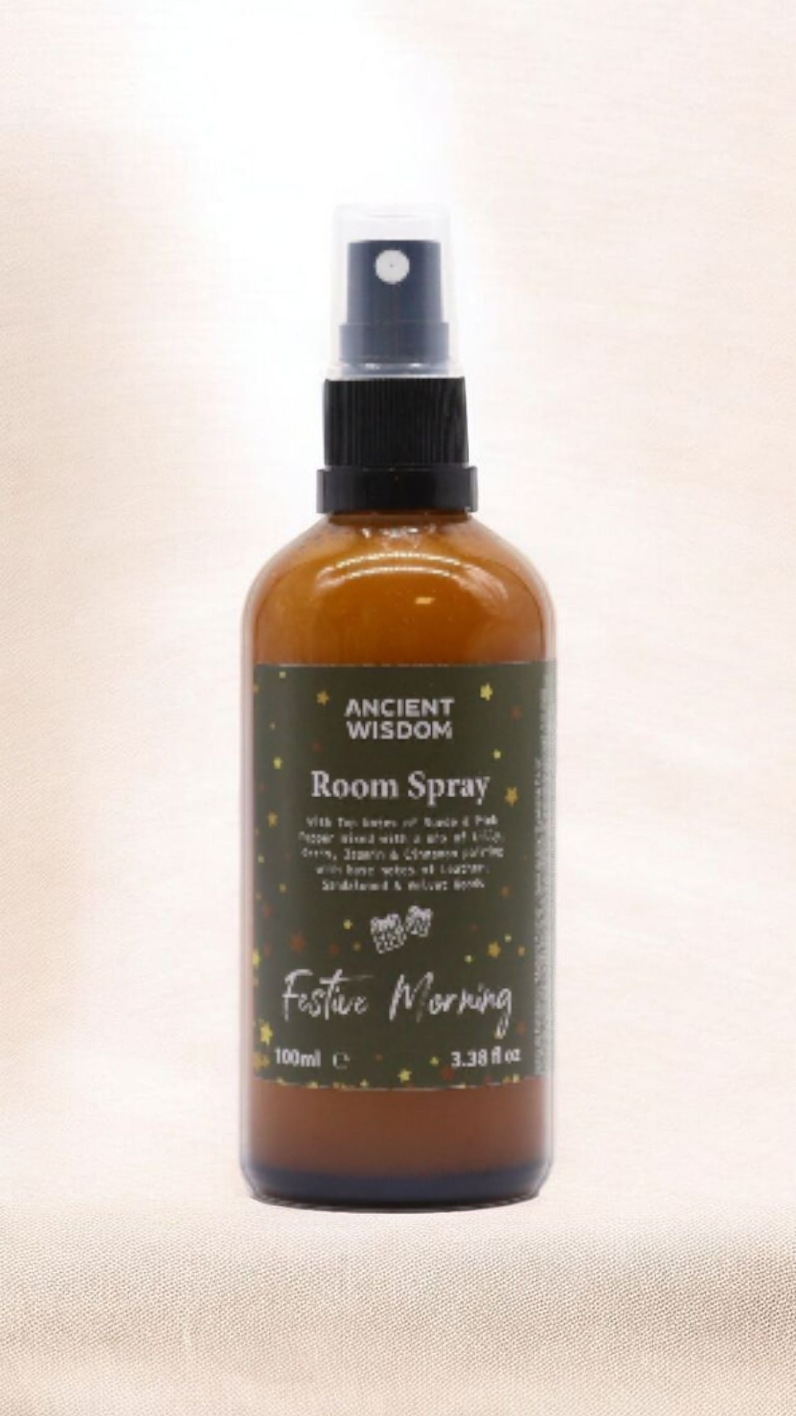 Festive Morning 100ml Christmas Room Spray showcased against an elegant backdrop, a wonderful Christmas gift that doubles as a stocking filler. This captivating festive fragrance, infused with warm spice, brings a scent of winter spice, cinnamon orange, and frankincense myrrh into your home. Perfect for creating a pamper pack, this aromatherapy product evokes the spirit of a white Christmas.